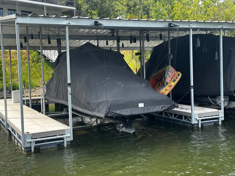 Slide: The Image of Covered Chaparral 26 Surf boat at dock, 2021 model. - 15