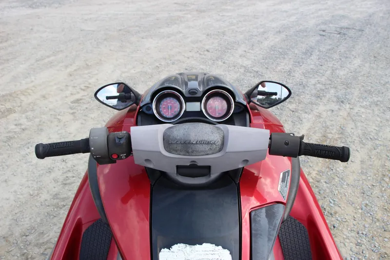 Slide: The Image of 2011 Yamaha WaveRunner FZS dashboard and handlebars, red and black design. - 12