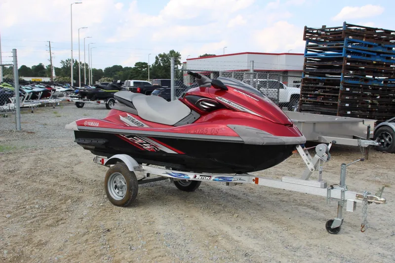 Slide: The Image of 2011 Yamaha WaveRunner FZS on trailer, red and black, parked outdoors. - 7