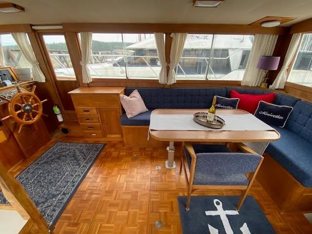 Slide: The Image of Interior of 1973 Grand Banks 42 Classic yacht with wooden decor and cozy seating area. - 22