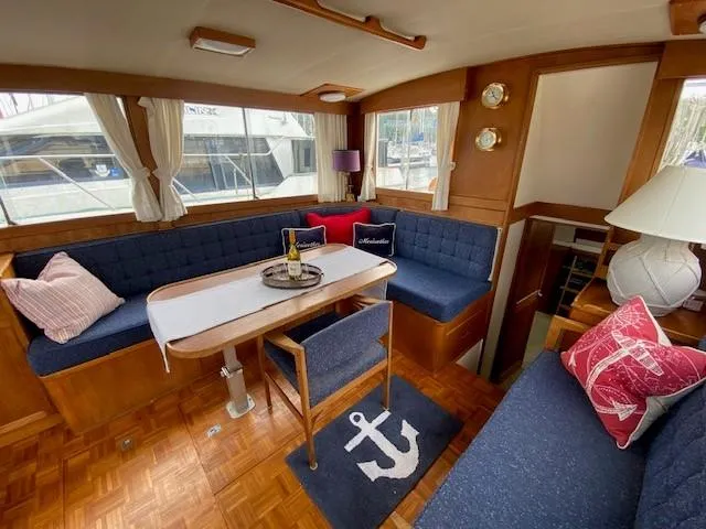 Slide: The Image of Interior of a 1973 Grand Banks 42 Classic yacht with cozy seating and nautical decor. - 23
