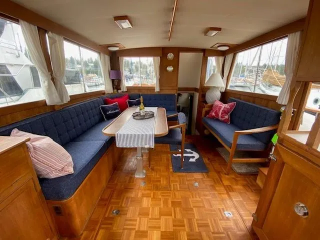Slide: The Image of Interior of a 1973 Grand Banks 42 Classic yacht with cozy seating and nautical decor. - 24