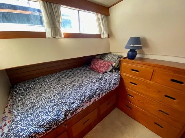 Slide: The Image of Cozy cabin interior of 1973 Grand Banks 42 Classic with bed, drawers, and lamp. - 28