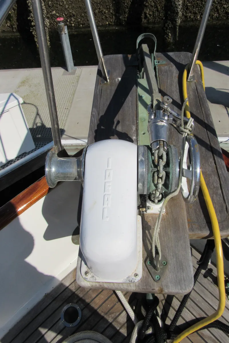 Slide: The Image of Anchor windlass on 1973 Grand Banks 42 Classic boat deck. - 37