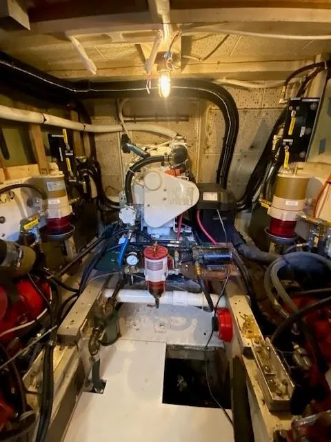 Slide: The Image of Engine room of a 1973 Grand Banks 42 Classic boat, showcasing mechanical components. - 41