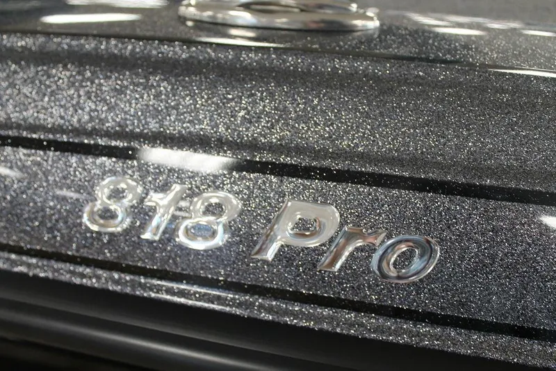 Slide: The Image of Close-up of 2025 Phoenix 818 Pro metallic logo on vehicle surface. - 3