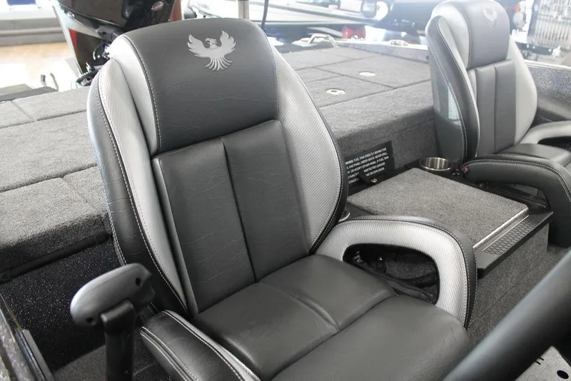 Slide: The Image of 2025 Phoenix 818 Pro boat interior with black and gray seating, featuring a sleek design. - 5