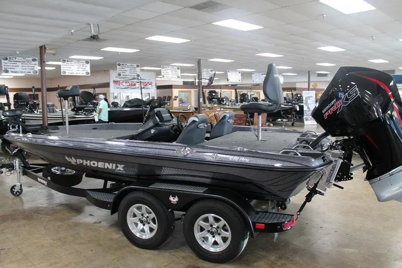 Slide: The Image of 2025 Phoenix 818 Pro boat displayed indoors, featuring sleek design and powerful engine. - 7