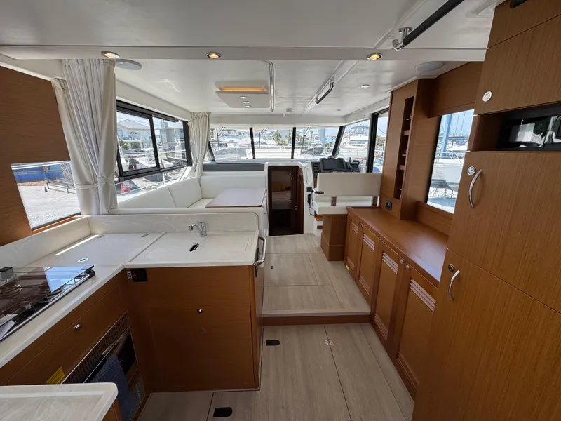 Slide: The Image of Interior of 2025 Beneteau Swift Trawler 41 Fly, featuring modern kitchen and seating area. - 17