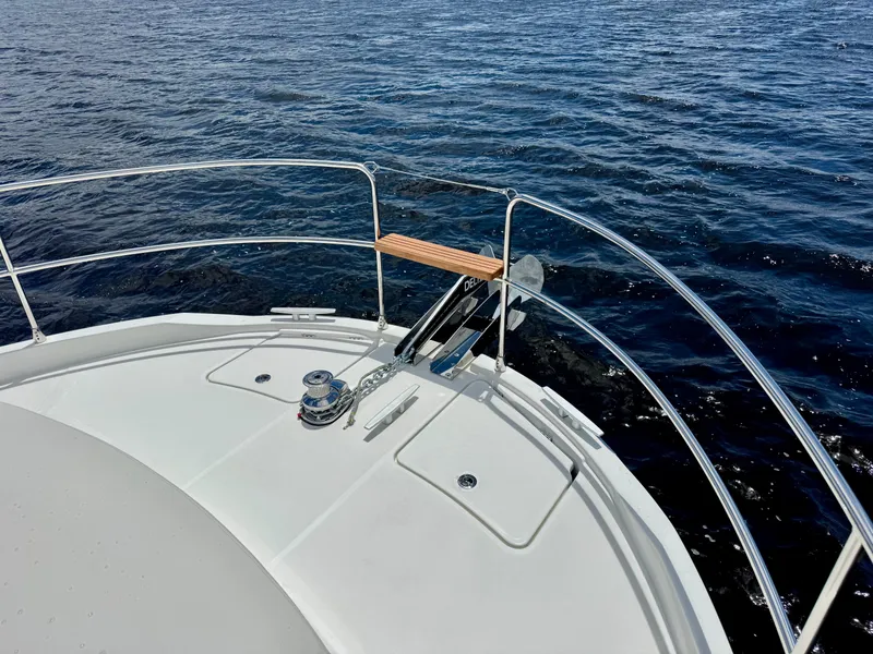 Slide: The Image of Bow of 2025 Beneteau Swift Trawler 41 Fly on open water. - 28