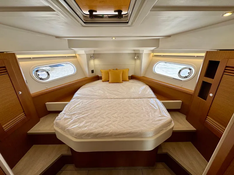 Slide: The Image of Luxurious cabin interior of 2025 Beneteau Swift Trawler 41 Fly with cozy bedding. - 3
