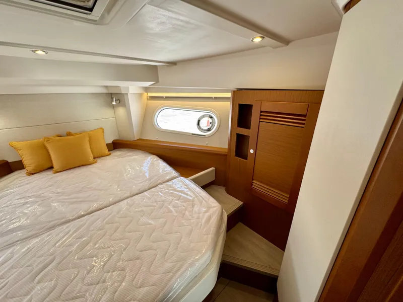 Slide: The Image of Luxurious cabin interior of 2025 Beneteau Swift Trawler 41 Fly with cozy bedding. - 5