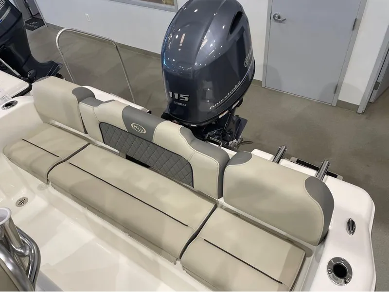 Slide: The Image of 2025 Key West 189 FS boat interior with Yamaha 115 engine, featuring cushioned seating. - 11