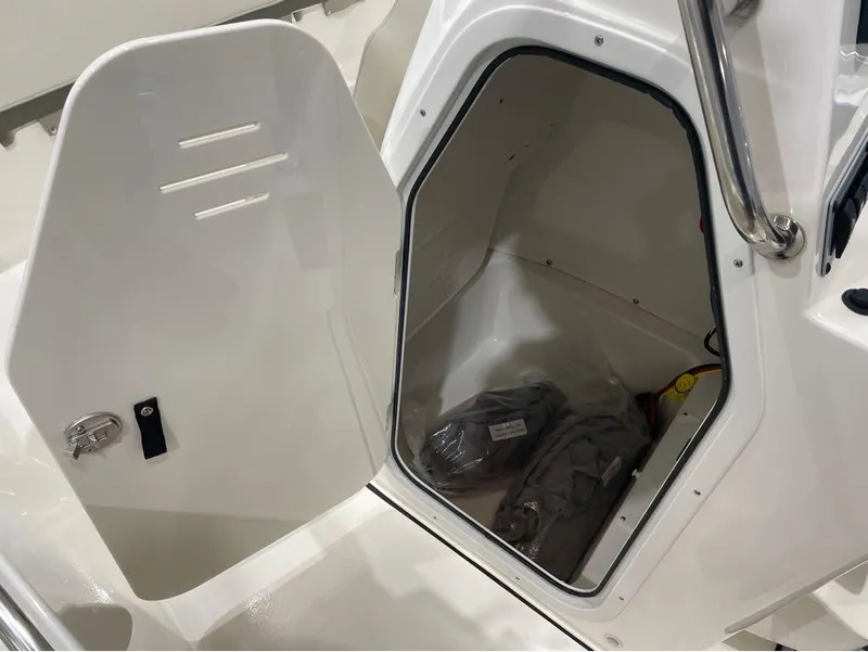 Slide: The Image of Open storage compartment on 2025 Key West 189 FS boat. - 7