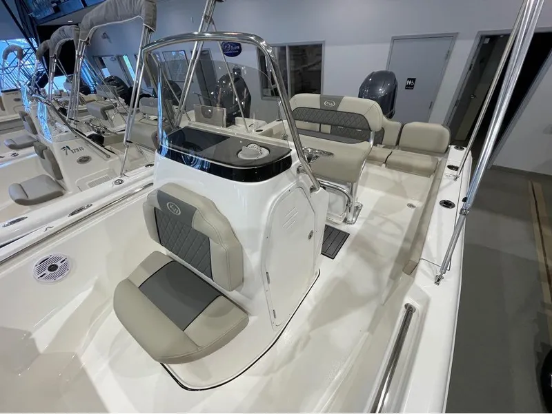Slide: The Image of 2025 Key West 189 FS boat interior with sleek seating and modern console design. - 9
