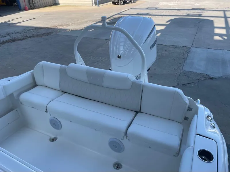 Slide: The Image of 2025 Key West 239 FS boat interior with white seating and Yamaha outboard motor. - 12