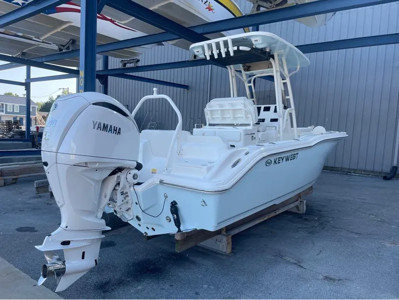 Slide: The Image of 2025 Key West 239 FS boat with Yamaha engine in a storage facility. - 15