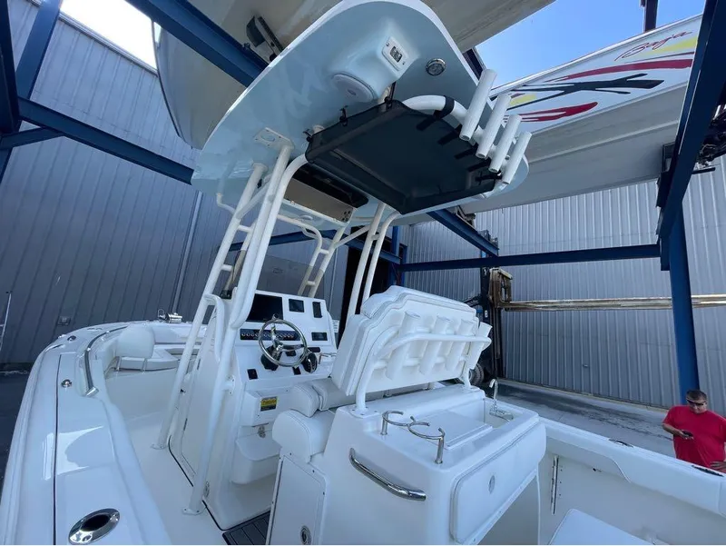 Slide: The Image of 2025 Key West 239 FS boat interior with helm and seating area. - 7