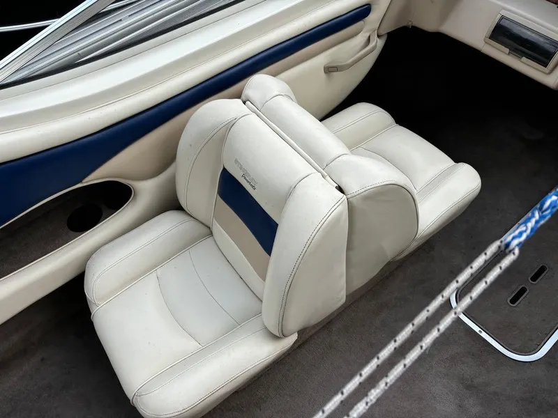 Slide: The Image of 1999 Stingray 190RS boat interior with beige and blue seating. - 15