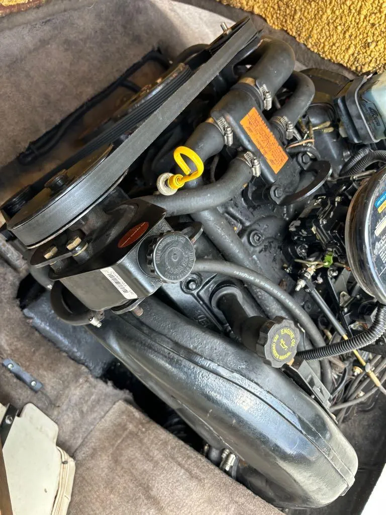 Slide: The Image of 1999 Stingray 190RS engine compartment with visible components and hoses. - 18