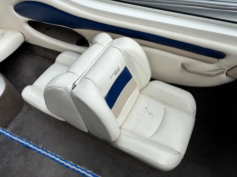 Slide: The Image of White and blue interior seat of a 1999 Stingray 190RS boat. - 19