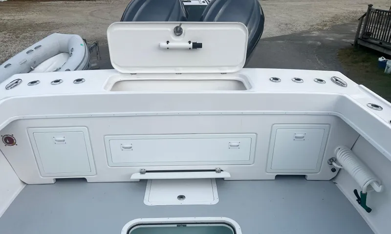 Slide: The Image of 2024 Steiger Craft 31 Fisherman boat deck with storage compartments and clean design. - 16