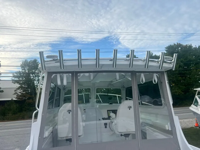 Slide: The Image of 2024 Steiger Craft 31 Fisherman boat with rod holders, viewed from the rear. - 17