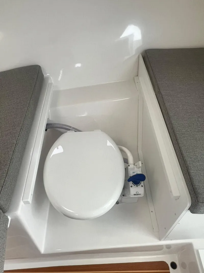 Slide: The Image of 2024 Steiger Craft 31 Fisherman boat interior with toilet and seating. - 21