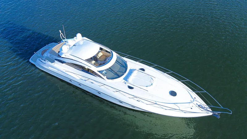 Slide: The Image of Sunseeker Predator 61 yacht, 2002 model, cruising on calm waters. - 1
