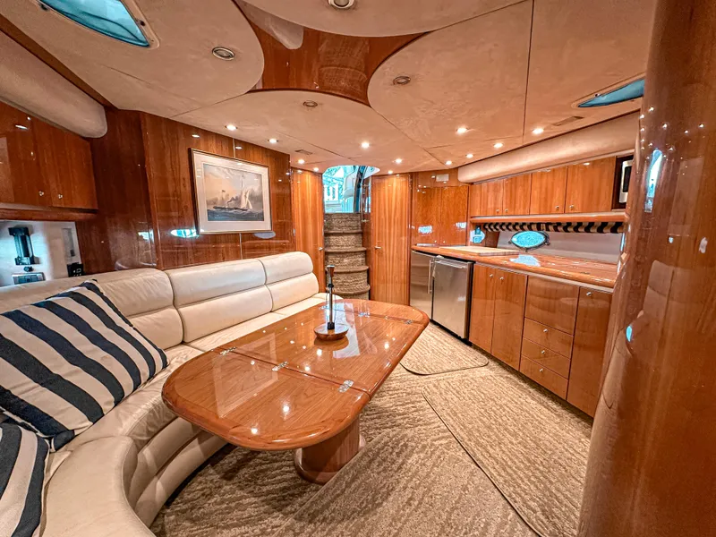 Slide: The Image of Luxurious interior of 2002 Sunseeker Predator 61 yacht with elegant wood finishes and plush seating. - 15