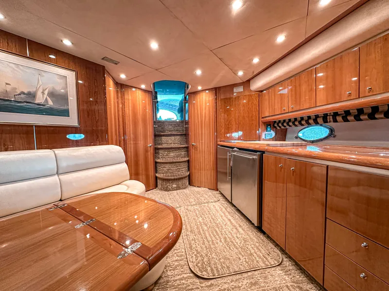 Slide: The Image of Luxurious interior of 2002 Sunseeker Predator 61 yacht with wood finishes and modern amenities. - 16