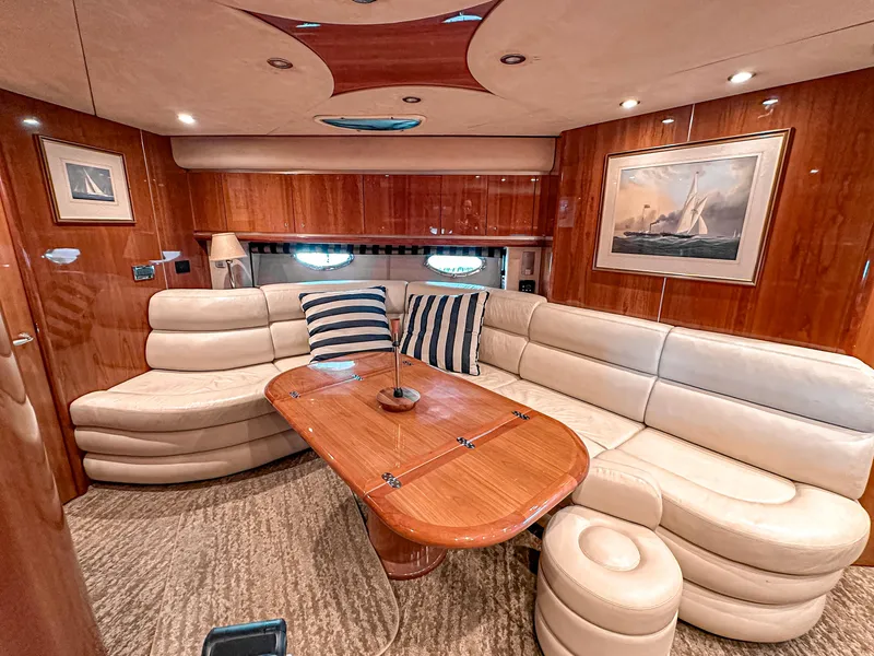 Slide: The Image of Luxurious interior of 2002 Sunseeker Predator 61 yacht with plush seating and elegant wood finishes. - 18