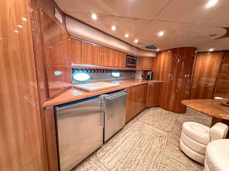 Slide: The Image of Luxurious interior of 2002 Sunseeker Predator 61 yacht with modern kitchen amenities. - 20