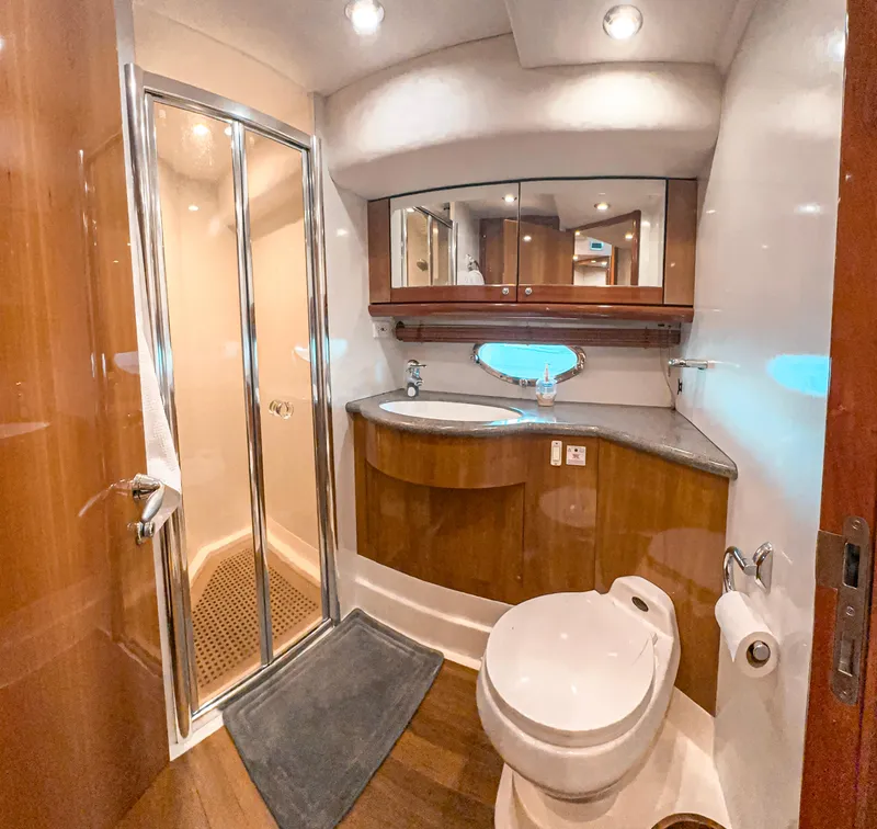 Slide: The Image of Luxurious bathroom in 2002 Sunseeker Predator 61 yacht with shower and modern fixtures. - 22