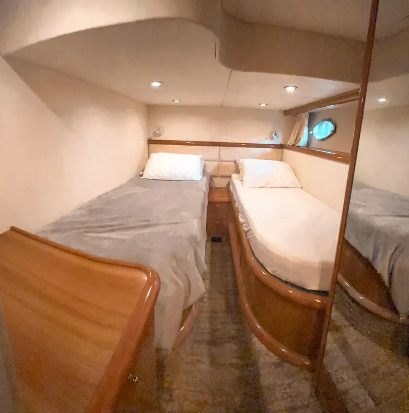 Slide: The Image of Cozy twin cabin in 2002 Sunseeker Predator 61 yacht. - 26