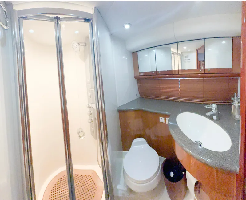 Slide: The Image of Luxurious bathroom in 2002 Sunseeker Predator 61 yacht with shower and modern fixtures. - 27