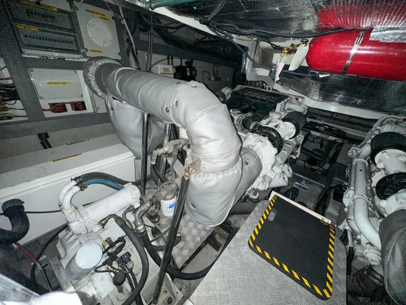 Slide: The Image of Engine room of 2002 Sunseeker Predator 61 yacht, showcasing mechanical components and systems. - 31