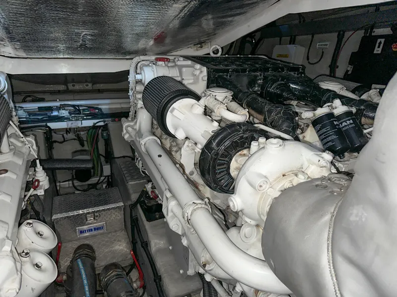 Slide: The Image of Engine room of 2002 Sunseeker Predator 61 yacht, showcasing powerful machinery and components. - 33