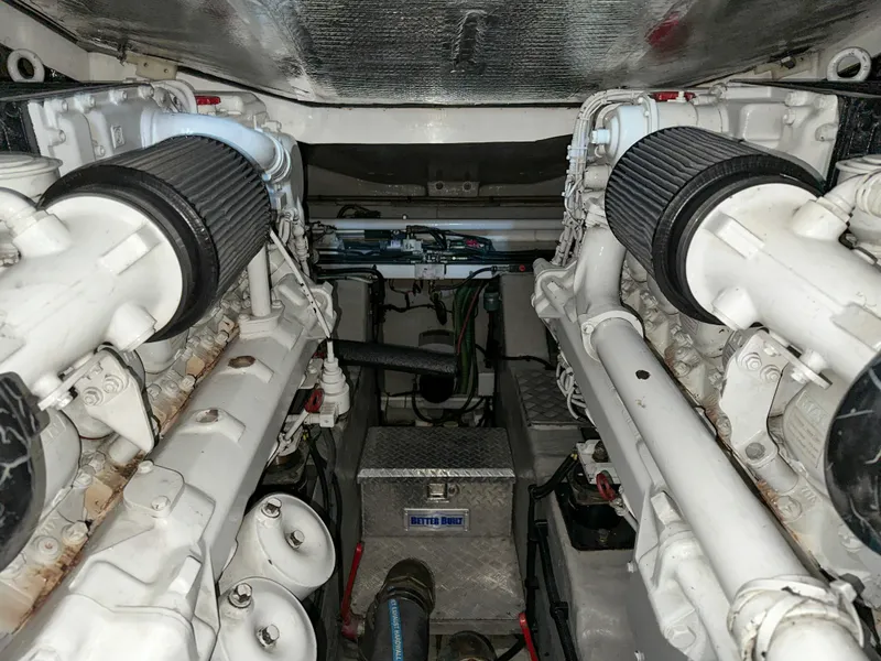 Slide: The Image of Engine room of 2002 Sunseeker Predator 61 yacht, showcasing dual engines and mechanical components. - 34