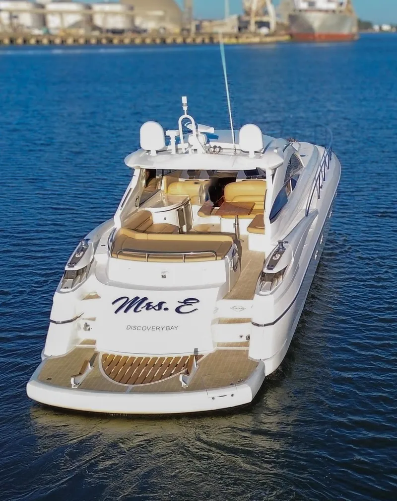 Slide: The Image of 2002 Sunseeker Predator 61 yacht on water, rear view, named "Mrs. E". - 6