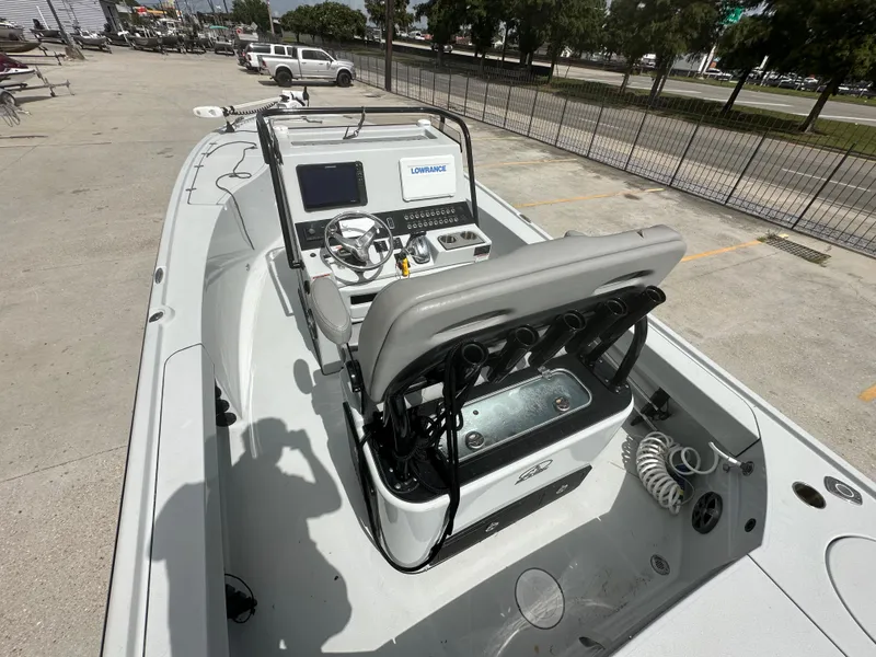 Slide: The Image of 2021 Blazer 2700 HYBRID BAY boat with modern console and seating. - 12