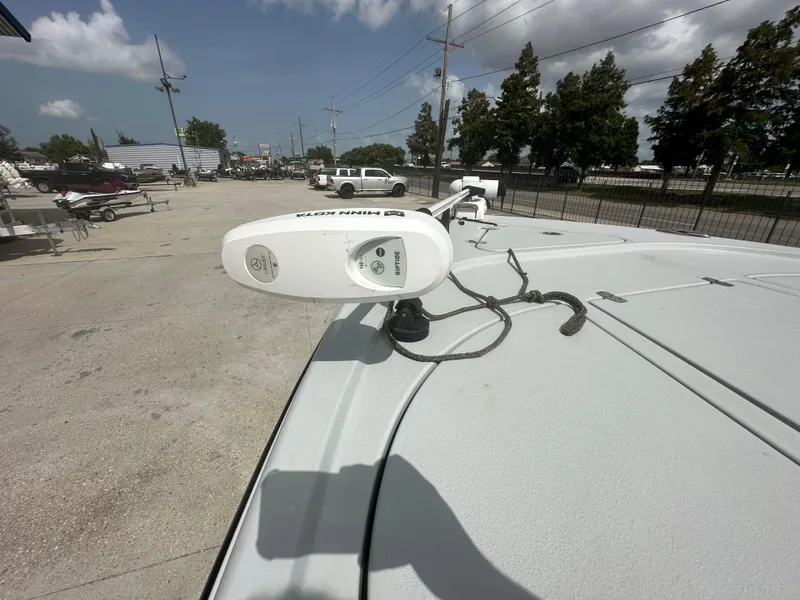 Slide: The Image of 2021 Blazer 2700 HYBRID BAY boat with mounted equipment in a parking area. - 14