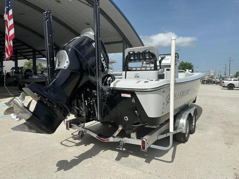 Slide: The Image of 2021 Blazer 2700 HYBRID BAY boat on trailer, powerful outboard motor, sunny day. - 3