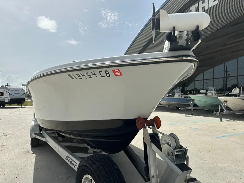 Slide: The Image of 2021 Blazer 2700 HYBRID BAY boat on trailer outside dealership. - 7