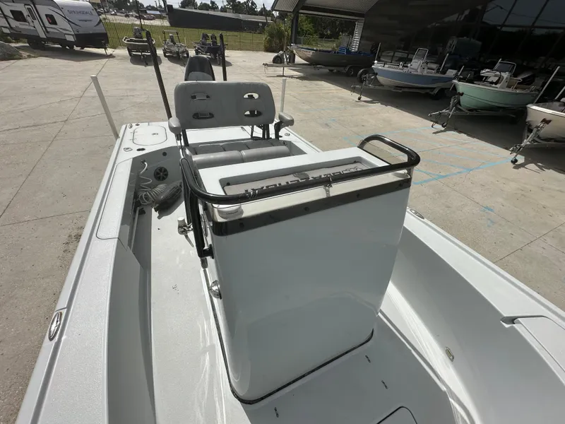 Slide: The Image of 2021 Blazer 2700 HYBRID BAY boat interior with seating and console. - 9
