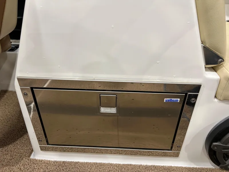 Slide: The Image of Stainless steel storage compartment on 2016 MasterCraft X26 boat. - 16