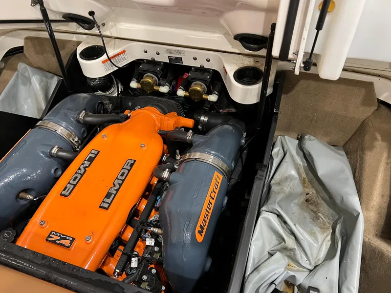 Slide: The Image of 2016 MasterCraft X26 engine compartment with Ilmor engine, showcasing performance components. - 19