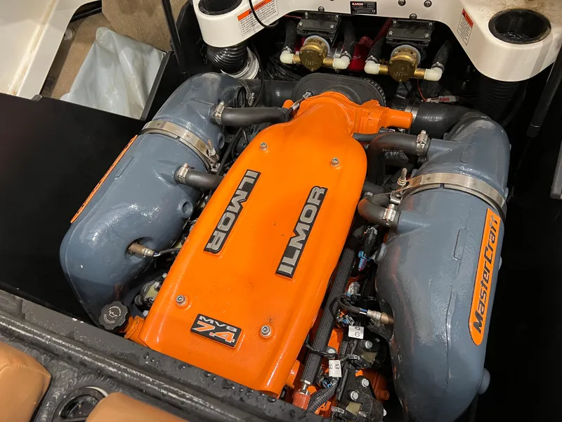 Slide: The Image of 2016 MasterCraft X26 engine with orange Ilmor V8 cover, showcasing powerful marine performance. - 20