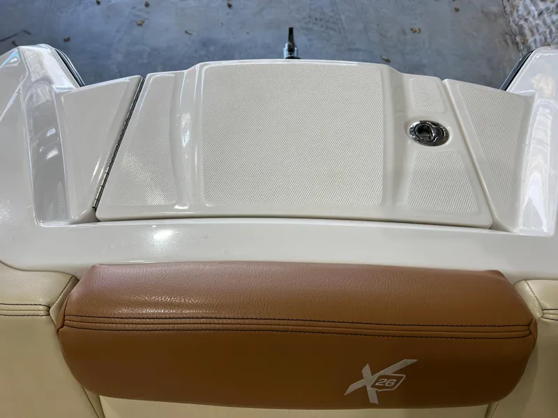 Slide: The Image of 2016 MasterCraft X26 boat interior with brown leather and white detailing. - 25