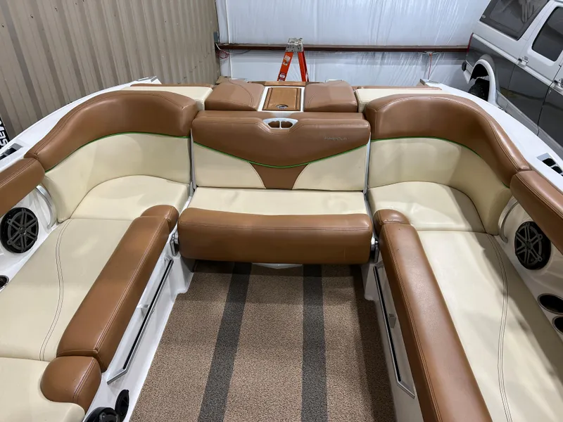 Slide: The Image of 2016 MasterCraft X26 boat interior with tan and cream seating. - 28